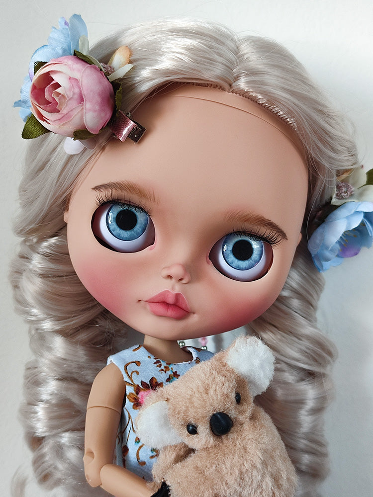 Custom blythe doll with big blue eyes and blonde hair